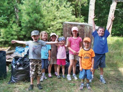 OHS Clean-up
From left to right: Aiden Harrington, Julia Sheridan, Alice DeCicco-Carey, Liz Harrington, Abby Simcox, Jacob Simcox and Joseph Sheridan helped clean up the littered trail behind the Old Hammondtown School Lambo Field on July 17, 2010. The trail is now clean as a whistle and the kids are hoping it will stay that way. Photo by Jessica DeCicco-Carey.
