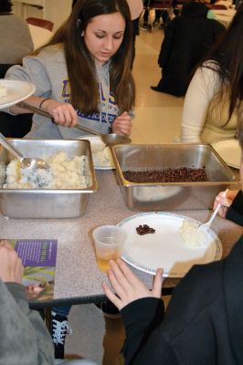Oxfam Fundraising Banquet
At the Old Rochester Regional Junior High School on February 13, guests of the Oxfam fundraising banquet got a taste of world hunger when they symbolically experienced the inequitable distribution of wealth and resources during a dinner of either just rice, rice or beans, or a full meal of rice, beans, and baked fish, determined at random by which ticket guests received at the door. Photo by Jean Perry
