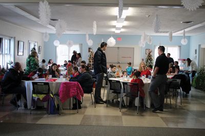 Pizza with Santa
The Marion Police Brotherhood held its annual Pizza with Santa at the Benjamin D. Cushing Community Center on Sunday, December 8. ‘Chief’ Santa and Mrs. Claus entertained the little ones before enjoying a pizza lunch. The Police Department’s “Fill a Cruiser” toy drive was in full gear as well, with several guests bringing toy donations to benefit children in foster care. Photos by Jean Perry
