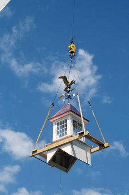 Plumb Library
A new cupola complete with a copper covered roof and refurbished bronze and copper eagle weathervane now graces the roof of the Plumb Library in Rochester center. Old Colony Regional Vocational Technical High School carpentry shop students in partnership with Diversified Roofing Systems, New Bedford, owned by Richard Miranda, built the new cupola for the town. Rochester’s facility manager Andrew Daniel spearheaded the project and brought together the school and business partners. Photo by Marilou Newell
