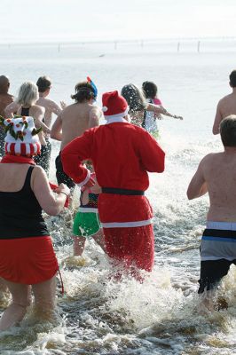 14th Annual Christmas Day Swim
The Helping Hands and Hooves 14th Annual Christmas Day Swim got a helping hand from the unseasonably warm weather, drawing in roughly 80 participants who took the polar plunge to support the organization’s therapeutic horseback riding program for adults with special needs. Photos by Colin Veitch

