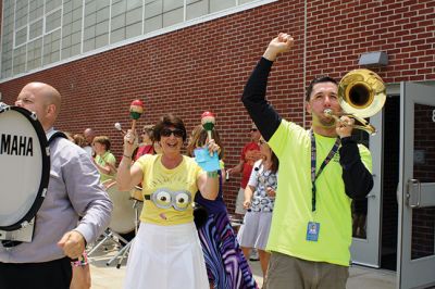 Last Day of School
June 19 was the last day of school at RMS, and the teachers and staff celebrated with their traditional student sendoff. Conductor Danni Kleiman led the teachers in song as the busses full of waving students looped around the parking lot before heading off toward summer break. Photos by Jean Perry
