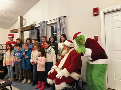 Rochester Tree Lighting
Santa was in Rochester last weekend! Both Santa and the Grinch were present, along with residents of the Tri-Town to take part in Rochester’s tree lighting on November 30. The rain was heavy but the hearts light. Photo by Michael J. DeCicco
