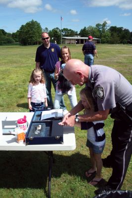 Safety Days
The Marion Police Brotherhood hosted their first annual Public Safety Day at Marion's Silvershell Beach on Saturday, June 13. The event included the installation of child safety seats in residents' vehicles, fingerprint and photo id cards for children along with displays from a variety of local, state and federal government public safety agencies. Photo by Robert Chiarito.
