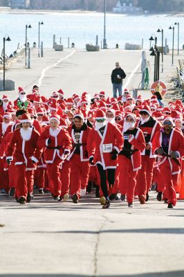 Santa Run 
Saturday, December 7, was the Santa Run 5k through the village of Mattapoisett. Usually held in New Bedford, race organizer Geoff Smith moved the race to Mattapoisett, flooding the village streets with hundreds of Santas – and a few Christmas miniature horses, as well. Photos by Jean Perry
