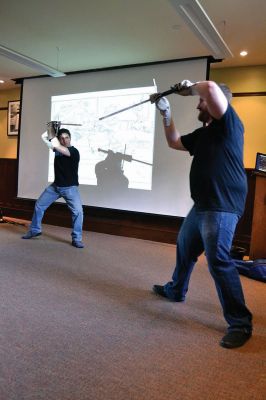Cold Steel
“Cold Steel” was one of the educating and exciting free programs the Mattapoisett Free Library offers during the summer. Visitors learned all about the history of swords and the origins of sword fighting, while Jeff Lord and Jeff Goodkind from the Association for Renaissance and Medieval Swordsmanship gave live demonstrations before a crowd of enthusiastic kids and adults. Photos by Jean Perry
