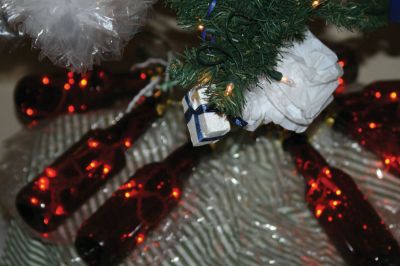 Annual Tree Sale
A Decorating Committee from the Sippican Womans Club produced over 50 festive trees for the Tree Spree, which started in Handys Tavern. The tavern was decked out with themed trees, including a Barbie tree, a Hannukah tree, a Mallard duck tree, and even a tree decorated with recycled items like bottles and plastic bags. Photo by Anne OBrien-Kakley.
