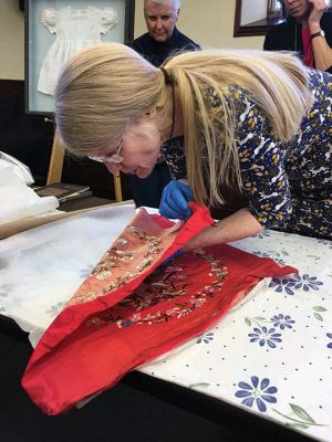 Textile Conservation
Kathryn Tarleton gave a presentation on the art and science of textile conservation on March 18 at the Mattapoisett Free Public Library. She also examined historic articles for several area residents. Photos by Marilou Newell
