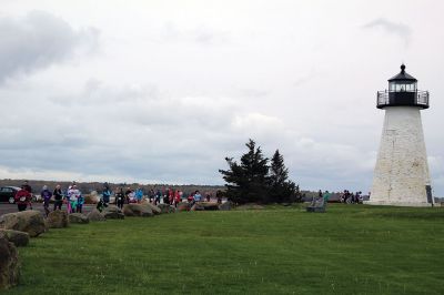 Mother’s Day Tiara 5k
Sunday’s wind and rain wasn’t stopping the hundreds who participated in the annual Mother’s Day Tiara 5k in Mattapoisett on May 10.  The storm brought strong wind and cold rain to the area, especially at the turn around Ned’s Point Lighthouse, dampening the day but not the sentiment behind the Women’s Fund of Southeastern Massachusetts’ largest annual fundraising event. Photos by Jean Perry
