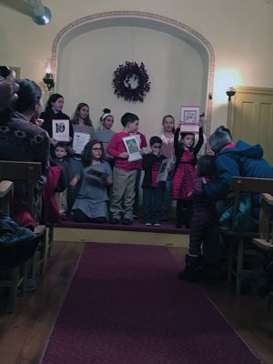 Tinkhamtown Chapel 
The annual Tinkhamtown Chapel carol sing-along on December 23 brought out young and old alike, including entire families. Gail Roberts on the chapel’s antique organ, along with Louise Anthony on violin, provided the melodies of familiar holiday favorites for the full house of singers. Photos by Marilou Newell
