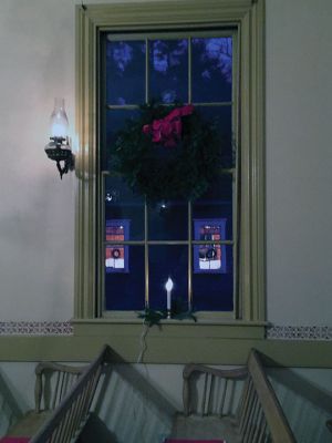 Tinkhamtown Chapel 
The lights from within the tiny Tinkhamtown Chapel spilled out into the cold dark on December 21, the longest eve of the year, for the annual Christmas carol sing-along. The warm and merry event has been held each year just before Christmas for nearly 70 years now. Photos by Marilou Newell
