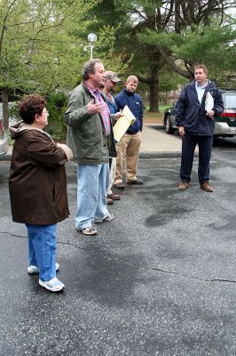 Marion Housing
Marion Affordable Housing Trust Chairman Reg Foster addresses a group of prospective architects, builders and engineers at the Little Neck Village housing complex on Saturday, May 3 along with Trust member Ora Mae Torres (foreground). The site visit also included a review of the proposed plans and a walk-through of the property in anticipation of bids to expand the 40B housing complex which are due on June 12. (Photo by Robert Chiarito).

