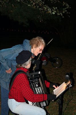 Cozy Campfire
The Mattapoisett Land Trust sponsored a bonfire at the Dunseith Gardens Seahorse property on Saturday, October 18, which included toasting marshmallows and entertainment provided by Luana Josvold. (Photo by Robert Chiarito).
