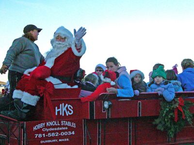 Santa's Sleigh
After arriving in Marion via boat at Island Wharf, Santa Claus mounted a carriage drawn by Clydesdale horses to participate in the town's 2006 Annual Holiday Village Stroll. (Photo by Robert Chiarito).

