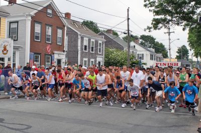 Mattapoisett Road Race
Runners leading the 1,000-plus member pack of registrants in the 2008 Mattapoisett Road Race held on July 4 start the long trek through Mattapoisett Village promptly at 9:00 AM. (Photo by Kenneth J. Souza).
