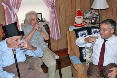 Citizen Cane
Ninety-eight-year-old Chester "Chet" Rollins of Rochester, seen here donning a top hat and sharing a toast with his wife Marjorie and Selectman Richard Nunes, recently received the Boston Post cane from the town Selectmen during a presentation ceremony at his home on Friday, December 19. (Photo by Kenneth J. Souza).
